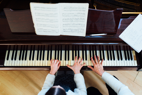 piano lessons at a music school, teacher and student